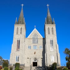 Martyrs Shrine Exterior 2 spires against a clear sky